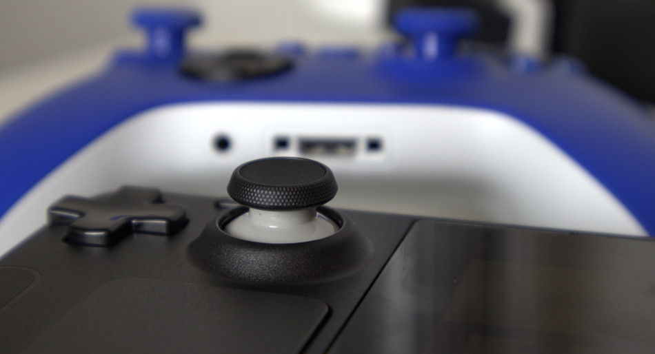 Close-up detail shot of the Steam Deck's D-pad, analogue stick and left trackpad